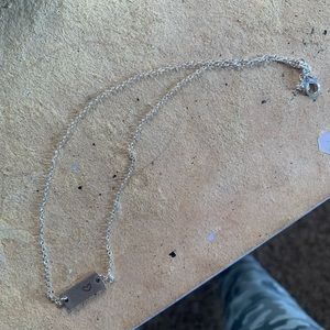 Silver bar with a heart necklace for $5 never worn.